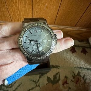 Michael Kors All Stainless Steel gunmetal watch With Stones around. 40 MM Case